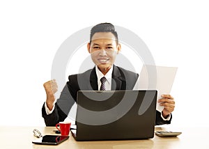 Asian Business man smile and giving fist using labtop computer on white background