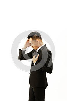 Asian business man standing left sideviews with headache Isolated on white backgrounds