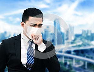 Asian business man suffer from cough with face mask protection photo