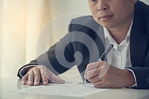 Asian business man using pen signing on new contract to starting projects in conference room. Close up manager businessman hands