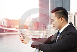 asian business man using smart phone