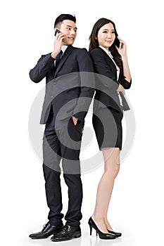 Asian business man and woman take a call