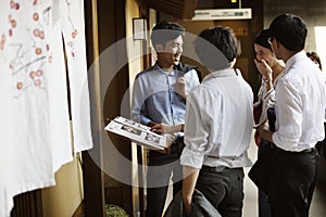 Asian business people hanging out at Japanese restaurant