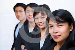 Asian business people line up