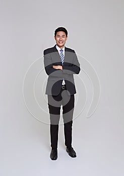 asian business people man good looking in studio. Full length Asian businessman in grey suit confident with crossed arms