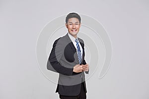 asian business people man good looking in studio. portrait businessman in grey suit confident friendly face