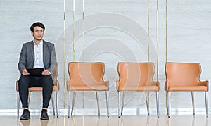 Asian business people are stressed about waiting for a job interview.