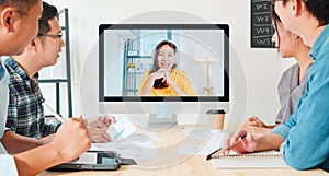 Asian business people video conference with colleague woman. Remote vdo call meeting, coworker teamwork brainstorm photo