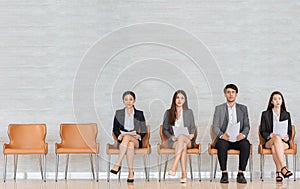 Asian business people are waiting for a job interview.