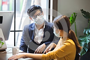 Asian business people with wearing hygienic mask prophylactic manager.