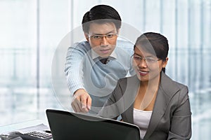 Asian business people working together