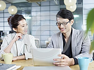 Asian business people working together in office