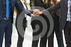 Asian Business Team showing Unity with their hands together
