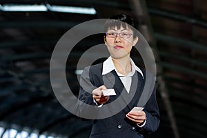 Asian business woman with calling card