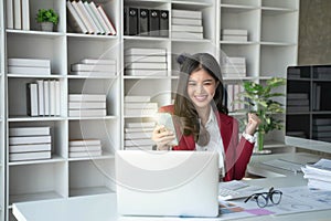 Asian business woman celebrating victory success Excited Success.