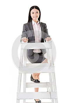 Asian business woman climb a ladder