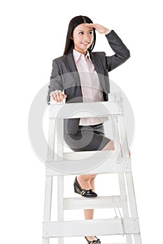 Asian business woman climb a ladder