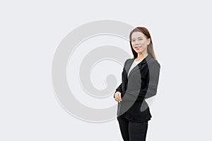 Asian business woman Crossed hands standing with long hair in black suit isolated on white color background