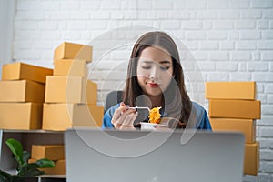 Asian business woman eating noodle at work for lunch time with unhappy face