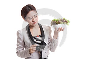 Asian business woman hate salad.