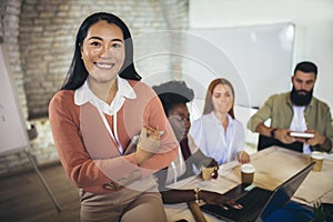 Asian business woman holding digital tablet in office