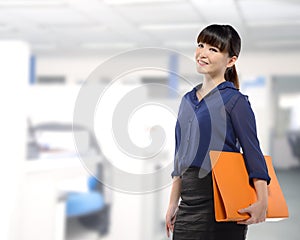 Asian business woman holding folder