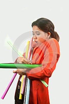 Busy business woman with a lot of colorful papers ,isolated on