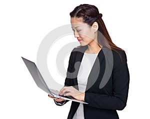 Asian business woman look at laptop computer