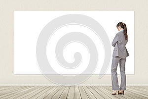 Asian business woman looking at blank banner