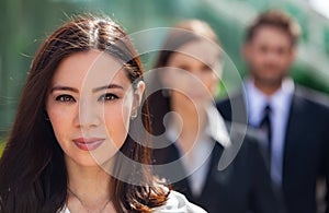 Asian Business Woman in Mixed Race Team