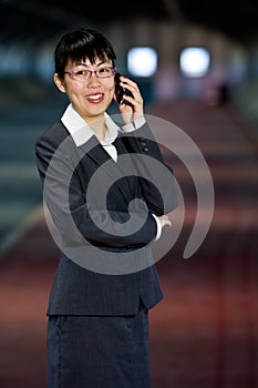 Asian business woman with mobile phone