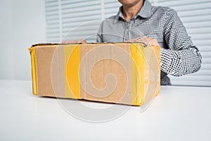 Asian business woman with package box