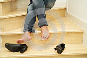 Asian business woman pain ankle, foot with leg cramp and fall down the stairs because slippery surfaces in office