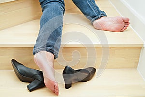 Asian business woman pain ankle, foot with leg cramp and fall down the stairs because slippery surfaces in office