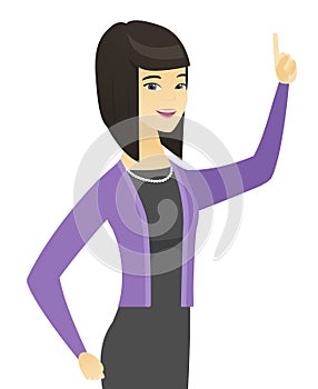 Asian business woman pointing her forefinger up.