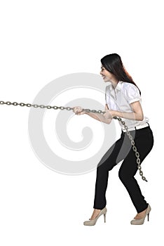 Asian business woman pulling chain