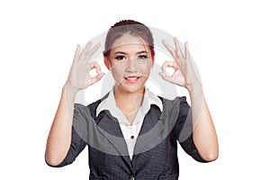 Asian business woman show double OK hand sign and