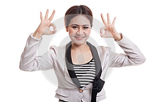 Asian business woman show double OK hand sign and smile.