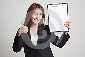 Asian business woman show thumbs up and blank clipboard.