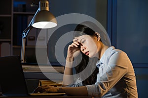 Asian business woman sleepy working overtime late night