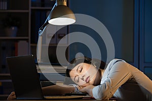 Asian business woman sleepy working overtime late night