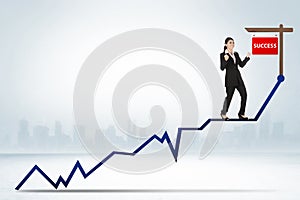 Asian business woman standing on the chart