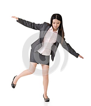 Asian business woman standing on precipice photo