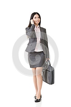 Asian business woman talking on the cell phone