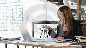 Asian business woman talking to colleague team about plan in video conference. Group of multiethnic business people