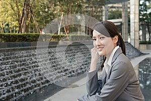Asian business woman thinking in the city