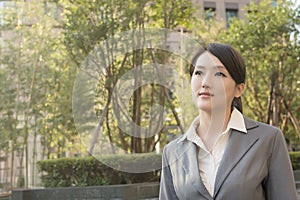 Asian business woman thinking in the city