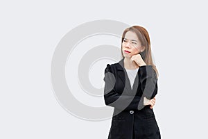 Asian business woman thinking hard with long hair in black suit isolated on white color background