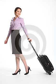 Asian business woman travelling with suitcase