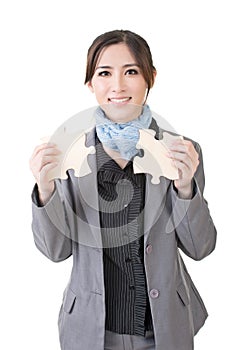 Asian business woman with two pieces of puzzle